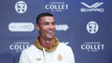 Al-Nassr's Cristiano Ronaldo smiles during a press conference in Osaka on July 23, 2023. Saudi Arabia's Al-Nassr are in Japan to play friendly matches against France's Paris Saint-Germain and Italy's Inter Milan. (Photo by PAUL MILLER / AFP)