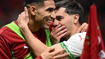 Morocco's defender #02 Achraf Hakimi (L) and Morocco's forward #10 Brahim Diaz (R) reacts after their team third goal during the Africa Cup of Nations (CAN) group stage football match between Zambia and Morocco at Prince Moulay Abdellah Stadium in Rabat on December 29, 2025. (Photo by Gabriel BOUYS / AFP)