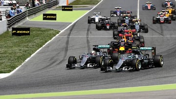 Nico Rosberg and Lewis Hamilton battle for position into the first corner
