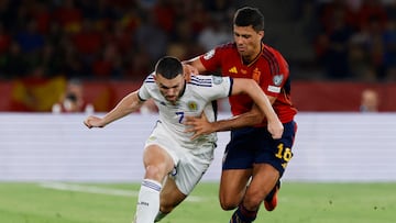 Soccer Football - Euro 2024 Qualifier - Group A - Spain v Scotland - Estadio de La Cartuja, Seville, Spain - October 12, 2023 Scotland's John McGinn in action with Spain's Rodri REUTERS/Marcelo Del Pozo