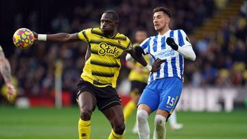 12 February 2022, United Kingdom, Watford: Brighton and Hove Albion&#039;s Jakub Moder (R) and Watford&#039;s Moussa Sissoko battle for the ball during the English Premier League socer match between Watford and Brighton &amp; Hove Albion at Vicarage Road.