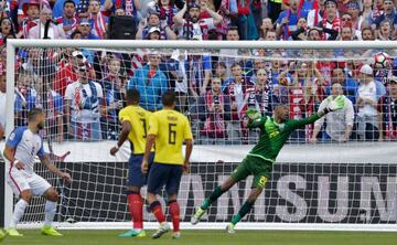 Dempsey (L) powers home his header.