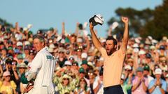 AUGUSTA, GEORGIA - APRIL 14: Scottie Scheffler of the United States and caddie Ted Scott celebrate on the 18th green after winning the 2024 Masters Tournament at Augusta National Golf Club on April 14, 2024 in Augusta, Georgia.   Andrew Redington/Getty Images/AFP (Photo by Andrew Redington / GETTY IMAGES NORTH AMERICA / Getty Images via AFP)