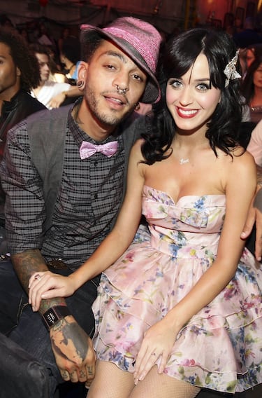 El vocalista de la banda Gym Class Heroes, fue un noviazgo que atrajo la atención a finales de la década de 2000. Comenzaron a salir alrededor de 2007 tras conocerse a través de un productor que trabajaba con ambos y Katy apareció en el videoclip de la canción de Gym Class Heroes, "Cupid's Chokehold". Su relación fue intermitente y duró aproximadamente hasta principios de 2009.