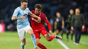 Iago Aspas pugna por el bal¨®n con Luis Milla durante el partido entre el Celta y el Getafe disputado en Bala¨ªdos.