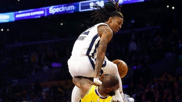 LOS ANGELES, CALIFORNIA - APRIL 24: Ja Morant #12 of the Memphis Grizzlies fouls LeBron James #6 of the Los Angeles Lakers in the second half of Game Four of the Western Conference First Round Playoffs at Crypto.com Arena on April 24, 2023 in Los Angeles, California. NOTE TO USER: User expressly acknowledges and agrees that, by downloading and/or using this photograph, user is consenting to the terms and conditions of the Getty Images License Agreement. Ronald Martinez/Getty Images/AFP (Photo by RONALD MARTINEZ / GETTY IMAGES NORTH AMERICA / Getty Images via AFP)