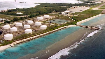 FILE PHOTO: Photo of fuel tanks at the edge of a miltary airstrip on Diego Garcia, largest island in the Chagos archipelago and site of a major United States military base in the middle of the Indian Ocean leased from Britain in 1966. Exiled inhabitants of Diego Garcia began a challenge July 17 to a British government decision to kick them off the remote island 30 years ago to make way for the U.S. base. Thousands of islanders from the 65-island Chagos archipelago, many of them born in exile in Mauritius, want Britain to return them to their homeland. clh/HO/U.S./File Photo