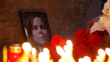 Flowers and candles are placed next to a portrait of media commentator Darya Dugina, who was killed in a car bomb attack, in Moscow, Russia August 22, 2022. REUTERS/Maxim Shemetov