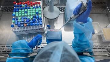 A laboratory staff wearing Personal Protective Equipments (PPE) conducts a procedure from samples collected for Covid-19 coronavirus testing as part of Project Ummeed, a public-private initiative dealing with large scale Covid-19 RT-PCR tests available fo