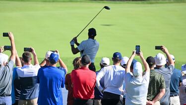 TULSA, OKLAHOMA - MAY 16: Fans watch Tiger Woods of the United States plays his shot from the 12th tee during a practice round prior to the start of the 2022 PGA Championship at Southern Hills Country Club on May 16, 2022 in Tulsa, Oklahoma. Ross Kinnaird