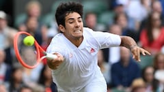 Chile&#039;s Cristian Garin returns against Serbia&#039;s Novak Djokovic during their men&#039;s singles fourth round match on the seventh day of the 2021 Wimbledon Championships at The All England Tennis Club in Wimbledon, southwest London, on July 5, 20