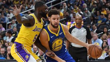 Klay Thompson ante Lance Stephenson en un duelo entre Warriors y Lakers