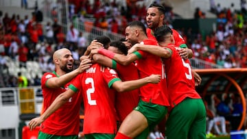 Morocco's defender #2 Achraf Hakimi (2L) celebrates with teammates after scoring his team's first goal during the Africa Cup of Nations (CAN) 2024 group F football match between Morocco and DR Congo at Stade Laurent Pokou in San Pedro on January 21, 2024. (Photo by SIA KAMBOU / AFP)