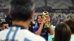 LUSAIL CITY, QATAR - DECEMBER 18: Antonela Roccuzzo, wife of Lionel Messi of Argentina, celebrates with the FIFA World Cup Qatar 2022 Winner's Trophy during the FIFA World Cup Qatar 2022 Final match between Argentina and France at Lusail Stadium on December 18, 2022 in Lusail City, Qatar. (Photo by David Ramos - FIFA/FIFA via Getty Images)