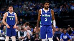 Kyrie Irving #2 of the Dallas Mavericks and teammate Luka Doncic #77 look on as the Mavericks play the Minnesota Timberwolves in the second half at American Airlines Center on February 13, 2023 in Dallas, Texas.