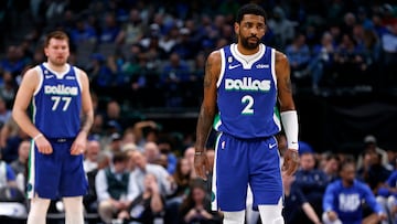 Kyrie Irving #2 of the Dallas Mavericks and teammate Luka Doncic #77 look on as the Mavericks play the Minnesota Timberwolves in the second half at American Airlines Center on February 13, 2023 in Dallas, Texas.