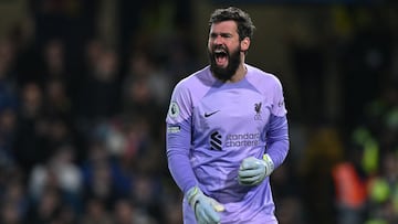 Liverpool's Brazilian goalkeeper Alisson Becker gestures during the English Premier League football match between Chelsea and Liverpool at Stamford Bridge in London on April 4, 2023. (Photo by Glyn KIRK / AFP) / RESTRICTED TO EDITORIAL USE. No use with unauthorized audio, video, data, fixture lists, club/league logos or 'live' services. Online in-match use limited to 120 images. An additional 40 images may be used in extra time. No video emulation. Social media in-match use limited to 120 images. An additional 40 images may be used in extra time. No use in betting publications, games or single club/league/player publications. /