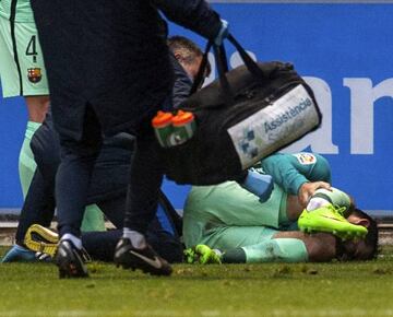 Aleix Vidal writhes in pain after a tackle from theo Hernandez.