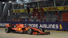 Ferrari&#039;s German driver Sebastian Vettel gestures to his team after winning the Formula One Singapore Grand Prix night race at the Marina Bay Street Circuit in Singapore on September 22, 2019. (Photo by Roslan RAHMAN / AFP)