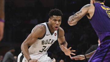 Mar 1, 2019; Los Angeles, CA, USA; Milwaukee Bucks forward Giannis Antetokounmpo (34) dribbles the ball past Los Angeles Lakers forward Kyle Kuzma (0) during the second half at Staples Center. Mandatory Credit: Robert Hanashiro-USA TODAY Sports