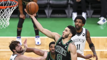 BOSTON, MA - MAY 28: Jayson Tatum #0 of the Boston Celtics drives to the basket past Blake Griffin #2 of the Brooklyn Nets during Game Three of the Eastern Conference first round series at TD Garden on May 28, 2021 in Boston, Massachusetts. NOTE TO USER: User expressly acknowledges and agrees that, by downloading and or using this photograph, User is consenting to the terms and conditions of the Getty Images License Agreement.   Adam Glanzman/Getty Images/AFP
 == FOR NEWSPAPERS, INTERNET, TELCOS &amp; TELEVISION USE ONLY ==