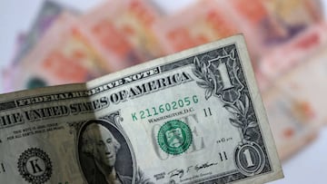 Generic image of dollars and Argentine pesos, on july 24, 2022, in Buenos Aires. (Photo by Carol Smiljan/NurPhoto via Getty Images)