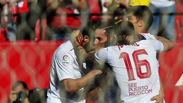 Sevilla's midfielder Pablo Sarabia (C) celebrates a goal with teammates during the Spanish league football match Sevilla FC vs RC Deportivo de la Coruna at the Ramon Sanchez Pizjuan stadium in Sevilla on April 8, 2017. / AFP PHOTO / CRISTINA QUICLER