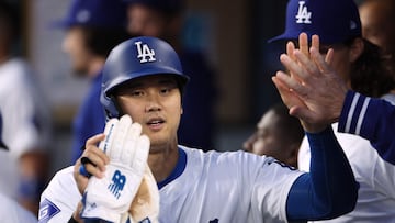 LOS ANGELES, CALIFORNIA - APRIL 15: Shohei Ohtani #17 of the Los Angeles Dodgers celebrates his run in the dugout during the first inning against the Washington Nationals at Dodger Stadium on April 15, 2024 in Los Angeles, California. All players are wearing the number 42 in honor of Jackie Robinson Day.   Harry How/Getty Images/AFP (Photo by Harry How / GETTY IMAGES NORTH AMERICA / Getty Images via AFP)