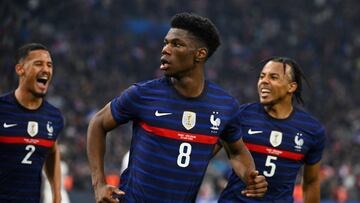France's midfielder Aurelien Tchouameni (C) celebrates after scoring a goal during the friendly football match between France and Ivory Coast at the Velodrome Stadium in Marseille, southern France, on March 25, 2022. (Photo by NICOLAS TUCAT / AFP)