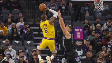 Dec 21, 2022; Sacramento, California, USA; Los Angeles Lakers forward LeBron James (6) shoots the ball over Sacramento Kings forward Domantas Sabonis (10) during the first quarter at Golden 1 Center. Mandatory Credit: Sergio Estrada-USA TODAY Sports