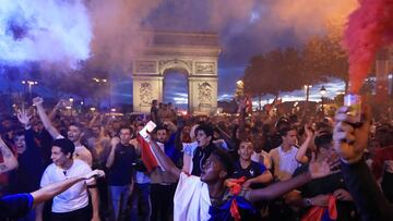 Soccer Football - World Cup - Semi-Final - France vs Belgium - Paris, France, July 10, 2018 - France fans react on the Champs-Elysees after defeating Belgium in their World Cup semi-final match. REUTERS/Gonzalo Fuentes