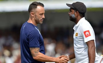 Sri Lanka's Dilruwan Perera (R) is congratulated by South Africa's captain Faf du Plessis (L) after Sri Lanka's victory in the opening Test match between Sri Lanka and South Africa at the Galle International Cricket Stadium in Galle on July 14, 2018.