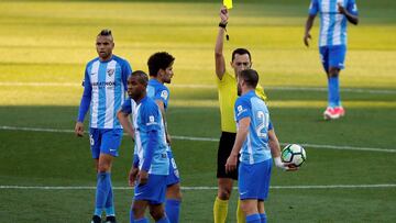 Soccer Football - La Liga Santander - Malaga CF vs Atletico Madrid - La Rosaleda, Malaga, Spain - February 10, 2018   Malaga&#039;s Mehdi Lacen is shown a yellow card by referee Jose Sanchez    REUTERS/Jon Nazca