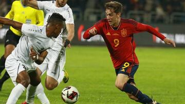 Jordan's defender Abdallah Naseeb (L) marks Spain's midfielder Gavi during the friendly football match between Jordan and Spain, at the Hussein Youth City stadium, in the Jordanian capital Amman on November 17, 2022. (Photo by Khalil MAZRAAWI / AFP) (Photo by KHALIL MAZRAAWI/afp/AFP via Getty Images)