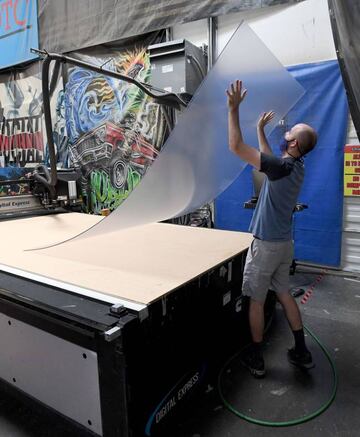 Jaeden Milam makes safety shield dividers at Screaming Images amid the spread of the coronavirus on 18 May 2020 in Las Vegas, Nevada.
