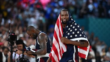 USA's #07 Kevin Durant celebrates after the USA won the men's Gold Medal basketball match between France and USA during the Paris 2024 Olympic Games at the Bercy Arena in Paris on August 10, 2024. (Photo by Aris MESSINIS / AFP)