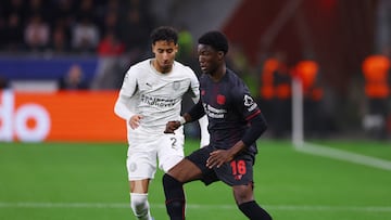Soccer Football - UEFA Champions League - Bayer Leverkusen v PSV Eindhoven - BayArena, Leverkusen, Germany - October 1, 2025 Bayer Leverkusen's Axel Tape in action with PSV Eindhoven's Anass Salah-Eddine REUTERS/Thilo Schmuelgen