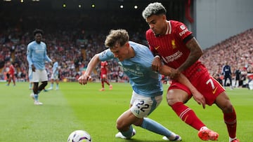 Nottingham Forest's English midfielder #22 Ryan Yates (L) fights for the ball with Liverpool's Colombian midfielder #07 Luis Diaz during the English Premier League football match between Liverpool and Nottingham Forest at Anfield in Liverpool, north west England on September 14, 2024. (Photo by Ian Hodgson / AFP) / RESTRICTED TO EDITORIAL USE. No use with unauthorized audio, video, data, fixture lists, club/league logos or 'live' services. Online in-match use limited to 120 images. An additional 40 images may be used in extra time. No video emulation. Social media in-match use limited to 120 images. An additional 40 images may be used in extra time. No use in betting publications, games or single club/league/player publications. /