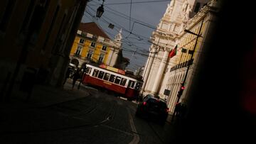 FILE PHOTO: A tram passes by Terreiro do Paco, moments before a government news conference to announce new coronavirus disease (COVID-19) restrictions, in Lisbon, Portugal, December 21, 2021. REUTERS/Pedro Nunes/File Photo