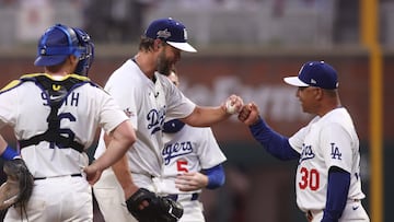 Jul 15, 2025; Cumberland, Georgia, USA; National League pitcher Clayton Kershaw (22) of the Los Angeles Dodgers reacts with manager Dave Roberts of the Los Angeles Dodgers in the second inning against the American League during the 2025 MLB All Star Game at Truist Park. Mandatory Credit: Brett Davis-Imagn Images