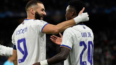 Real Madrid's French forward Karim Benzema (L) celebrates with Real Madrid's Brazilian forward Vinicius Junior (R) after scoring his team's second goal during the UEFA Champions League first round group D football match between Real Madrid