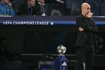 Manchester City's Spanish coach Pep Guardiola is pictured during the UEFA Champions League knockout phase play-off football match between Real Madrid CF and Manchester City at the Santiago Bernabeu stadium in Madrid on February 19, 2025. (Photo by JAVIER SORIANO / AFP)