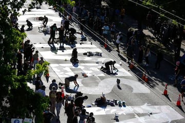 The words "Black Lives Matter" are painted in the middle of East Pine Street in an area being called the Capitol Hill Autonomous Zone (CHAZ).