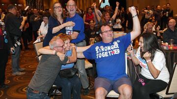LAS VEGAS, NV - NOVEMBER 08: (Front, L-R) Hillary Clinton supporters Kavin Burkhalter, Donna West, Jim Lovejoy and Lynnette Hull react after the state of Nevada was called for Clinton at the Nevada Democratic Party's election results watch party at the Aria Resort & Casino on November 8, 2016 in Las Vegas, Nevada. Donald Trump won the general election to become the next U.S. president. Ethan Miller/Getty Images/AFP
== FOR NEWSPAPERS, INTERNET, TELCOS & TELEVISION USE ONLY ==