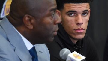 LOS ANGELES, CA - JUNE 23: Lonzo Ball looks on as Magic Johnson, president of basketball operations of the Los Angeles Lakers talks to the media during a press conference on June 23, 2017 at the team training faculity in Los Angeles, California.   Jayne Kamin-Oncea/Getty Images/AFP
 == FOR NEWSPAPERS, INTERNET, TELCOS &amp; TELEVISION USE ONLY ==