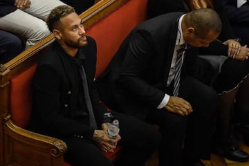 Neymar (L) attends the opening audience with his father Neymar Senior (R) at a courthouse in Barcelona on the first day of their trial.