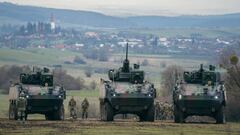 Romanian soldiers in armored personnel carriers participate in the Black Scorpions NATO 22.8 live-fire military exercise at the Getica National Joint Training Center in Cincu, Romania, on Friday, Nov. 25, 2022. Following Russia's attack on Ukraine, NATO allies have significantly bulked up their presence at the alliance's eastern borders, deploying more troops, jets and ships. Photographer: Andrei Pungovschi/Bloomberg via Getty Images