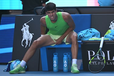MELBOURNE, AUSTRALIA - JANUARY 30: Carlos Alcaraz of Spain stretches his leg in the Men's Singles Semifinal match against Alexander Zverev of Germany during day 13 of the 2026 Australian Open at Melbourne Park on January 30, 2026 in Melbourne, Australia. (Photo by Quinn Rooney/Getty Images)