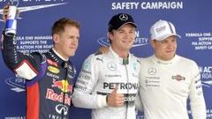 Nico Rosberg escoltado por Vettel y Bottas tras la calificaci&oacute;n. 