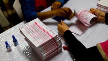 Employees of the National Electoral Institute (INE) seal ballots at a warehouse with voting materials for the recall referendum on President Andres Manuel Lopez Obrador, which will be held on April 10, in Ciudad Juarez, Mexico March 22, 2022. REUTERS/Jose Luis Gonzalez